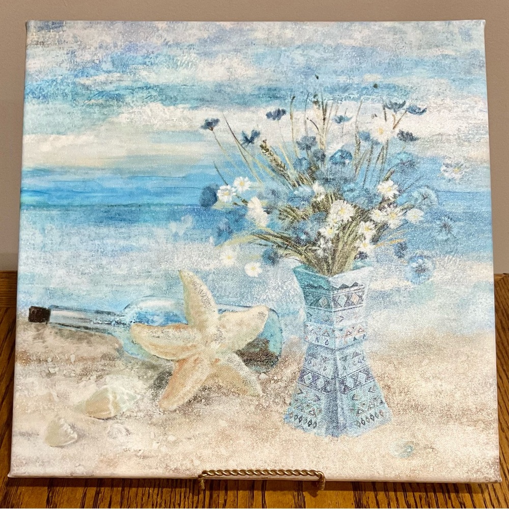 Painted canvas beach scene in blues & tan starfish, bottle, vase flowers & shell